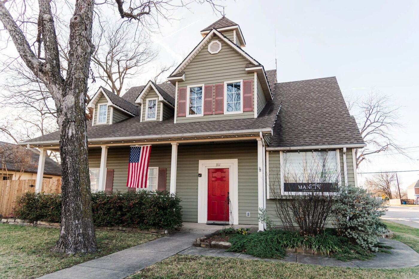 The Texas Christian Wellness office in Wylie, Texas: a converted house with a red front door